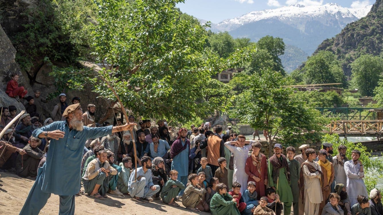 A village gathering in Kamdesh beneath the mountains of Nuristan