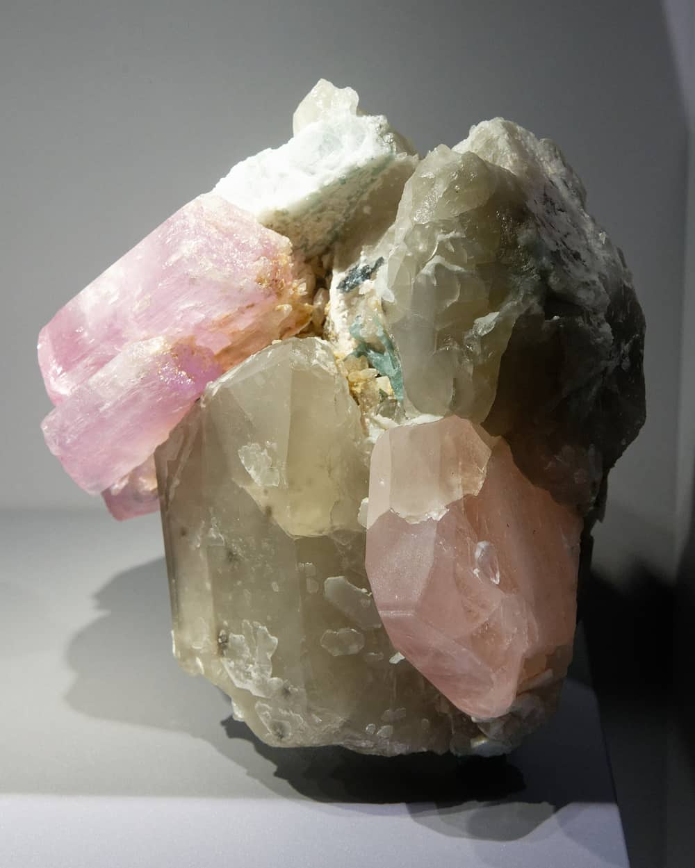 Kunzite, pink morganite and tourmaline grown against grey quartz, from the Pech valley in Kunar beside Nuristan