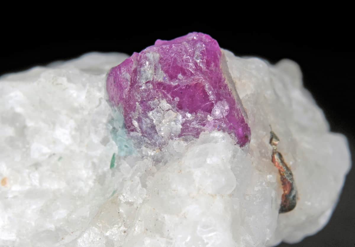 Jegdalek ruby crystals with brassy pyrite in calcite marble, Afghanistan