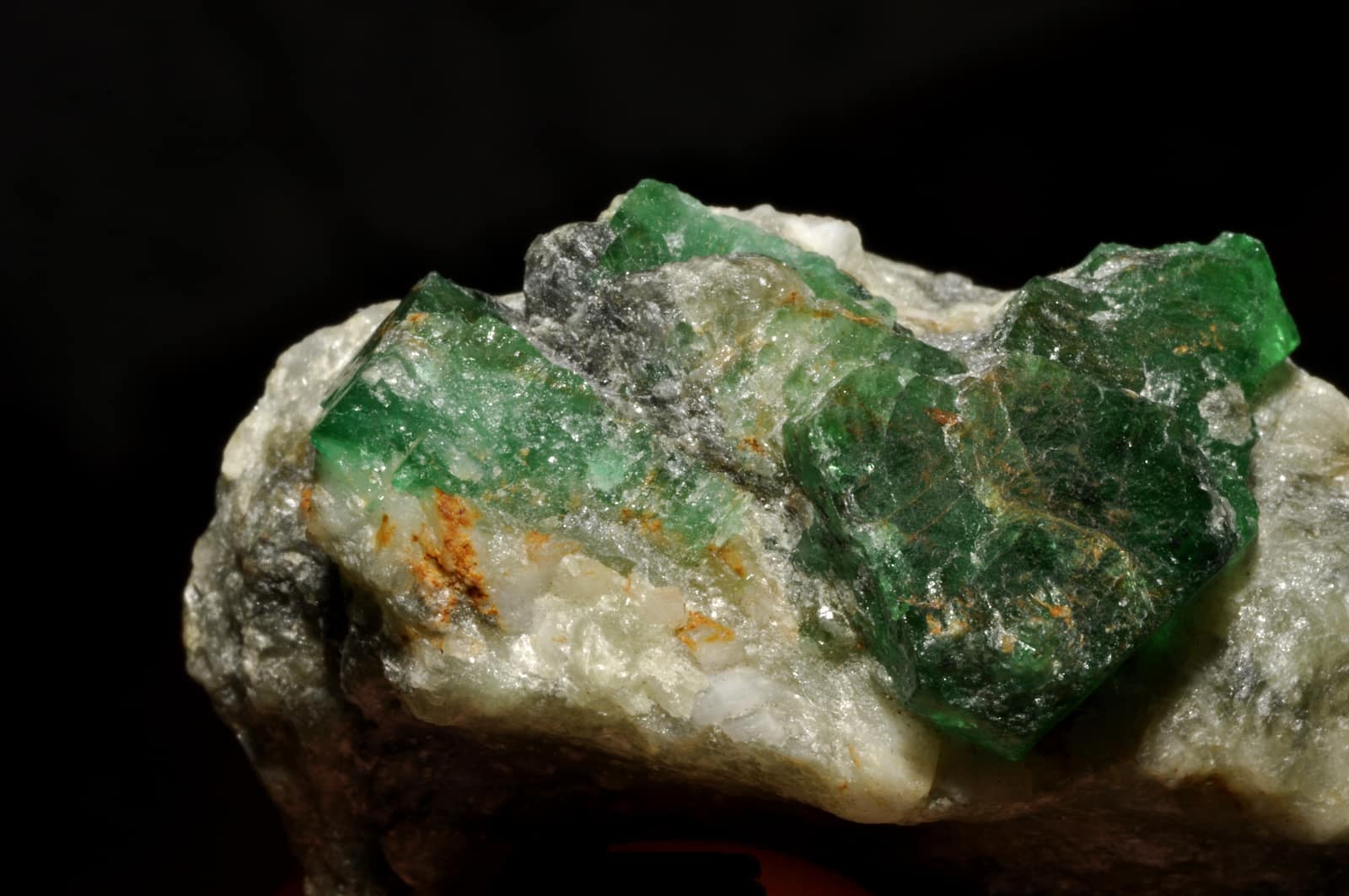 A green emerald crystal on white calcite from Bazarak in the Panjshir valley, Afghanistan